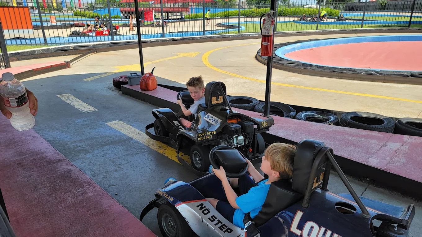 Kids racing go-karts at Adventure Landing Dallas